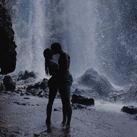 Couple embracing at a waterfall in the Philippines